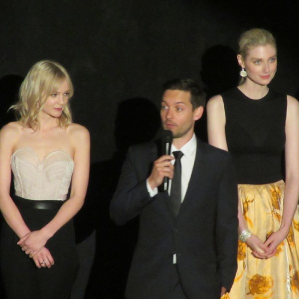 Tobey Maguire giving a speech at the Great Gatsby premiere with Carey Mulligan and Elizabeth Debicki.
