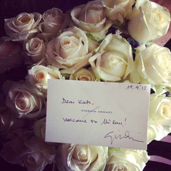 A bunch of long stem white roses and a personal note from Giorgio Armani