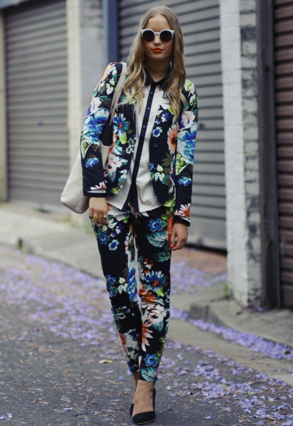 floral two piece suit and white trimmed sunglasses