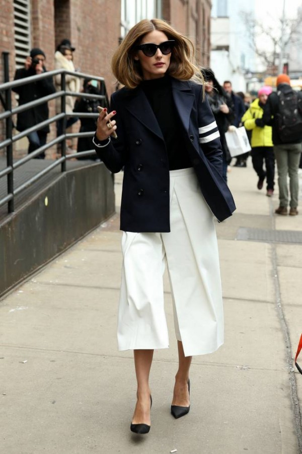 STREET STYLE: Fashion blogger Olivia Palermo, wearing white culotte pants with a navy blazer attends the Tibi fashion show on February 14, 2015 in New York City. Olivia is shown the crosshairs of two photographers! Pictured: Olivia Palermo Ref: SPL951658 140215 Picture by: Christopher Peterson/Splash News Splash News and Pictures Los Angeles: 310-821-2666 New York: 212-619-2666 London: 870-934-2666 photodesk@splashnews.com 