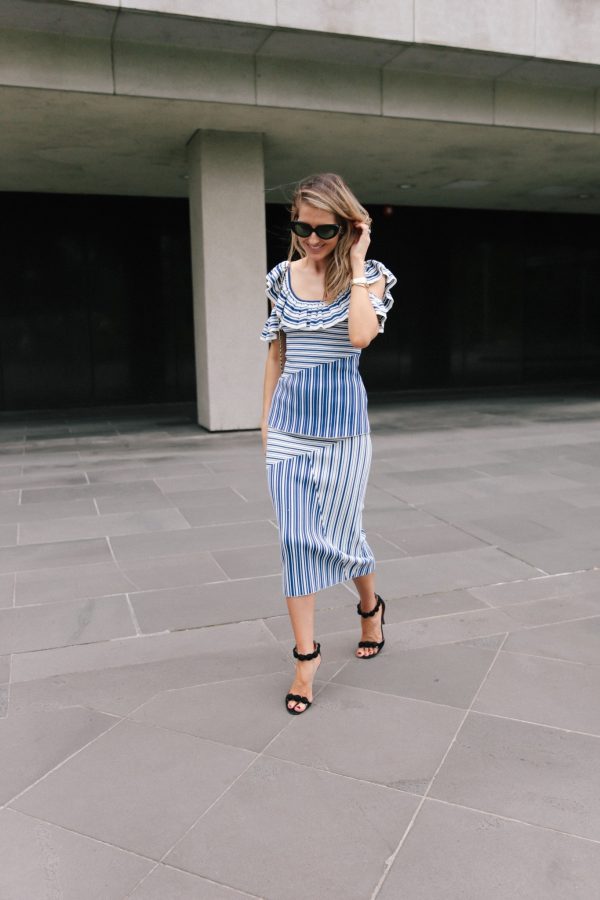 Kate Waterhouse street style walking in Rebecca Vallance top and skirt