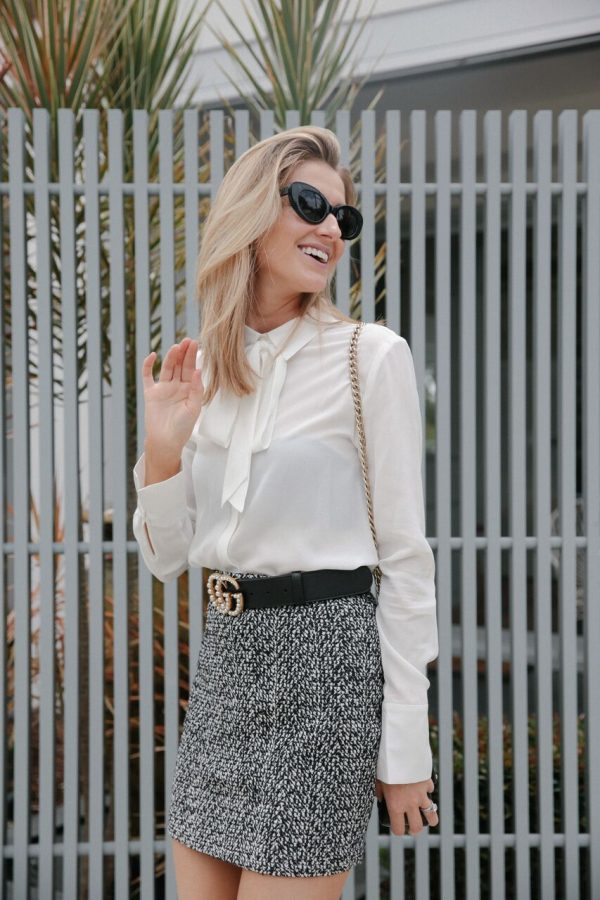 Kate Waterhouse street style laughing in Banded Together shirt and Gucci belt